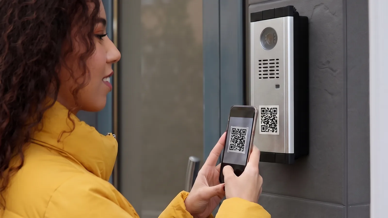 Person scanning an intercom QR code with a smartphone